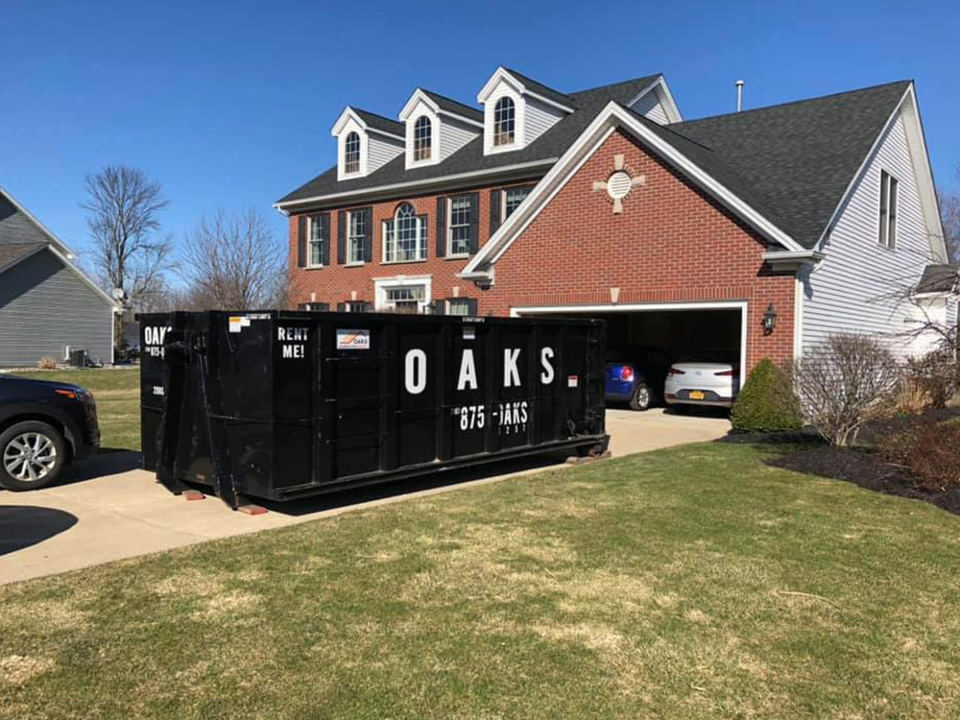 Dumpster in front of a house
