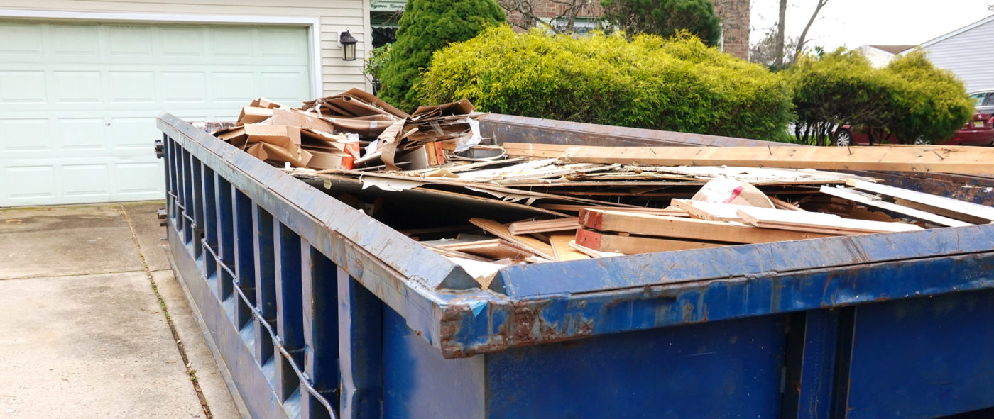 Filled blue dumpster