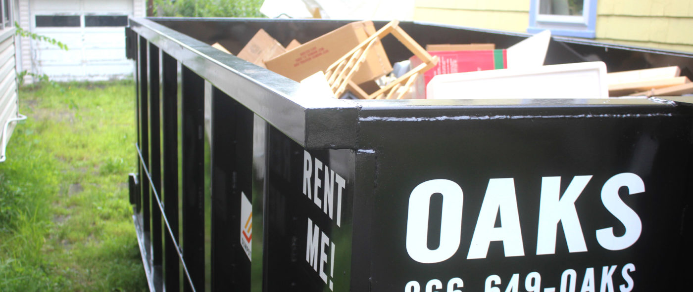 Close up of a filled Oaks dumpster