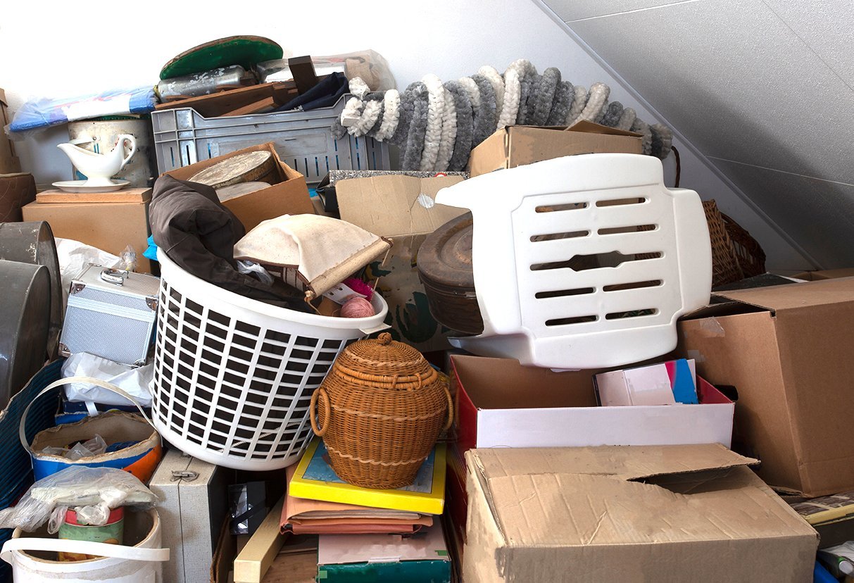 A storage room filled with boxes, baskets, and household items