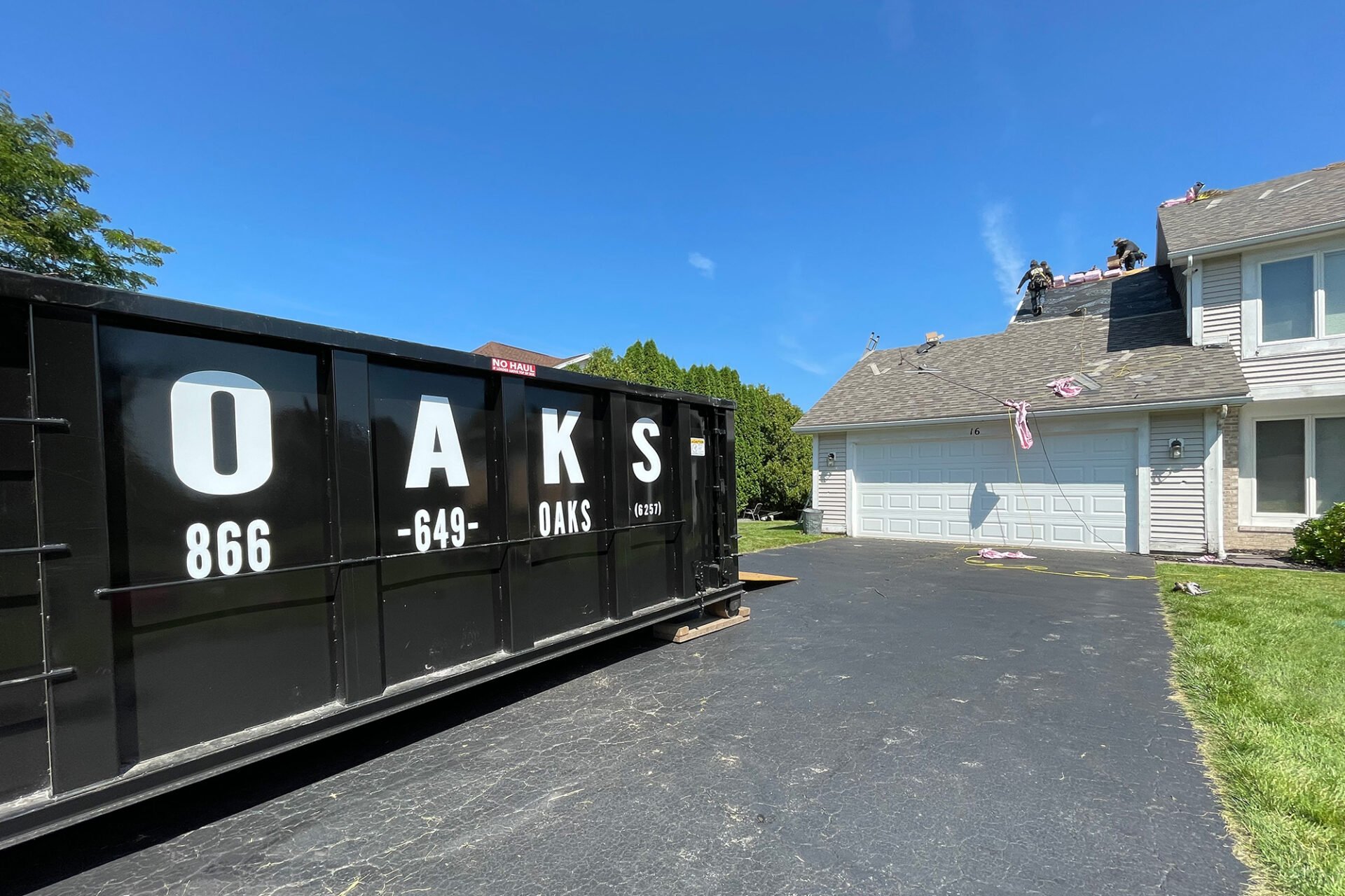 Close up of Rent Me text on a dumpster