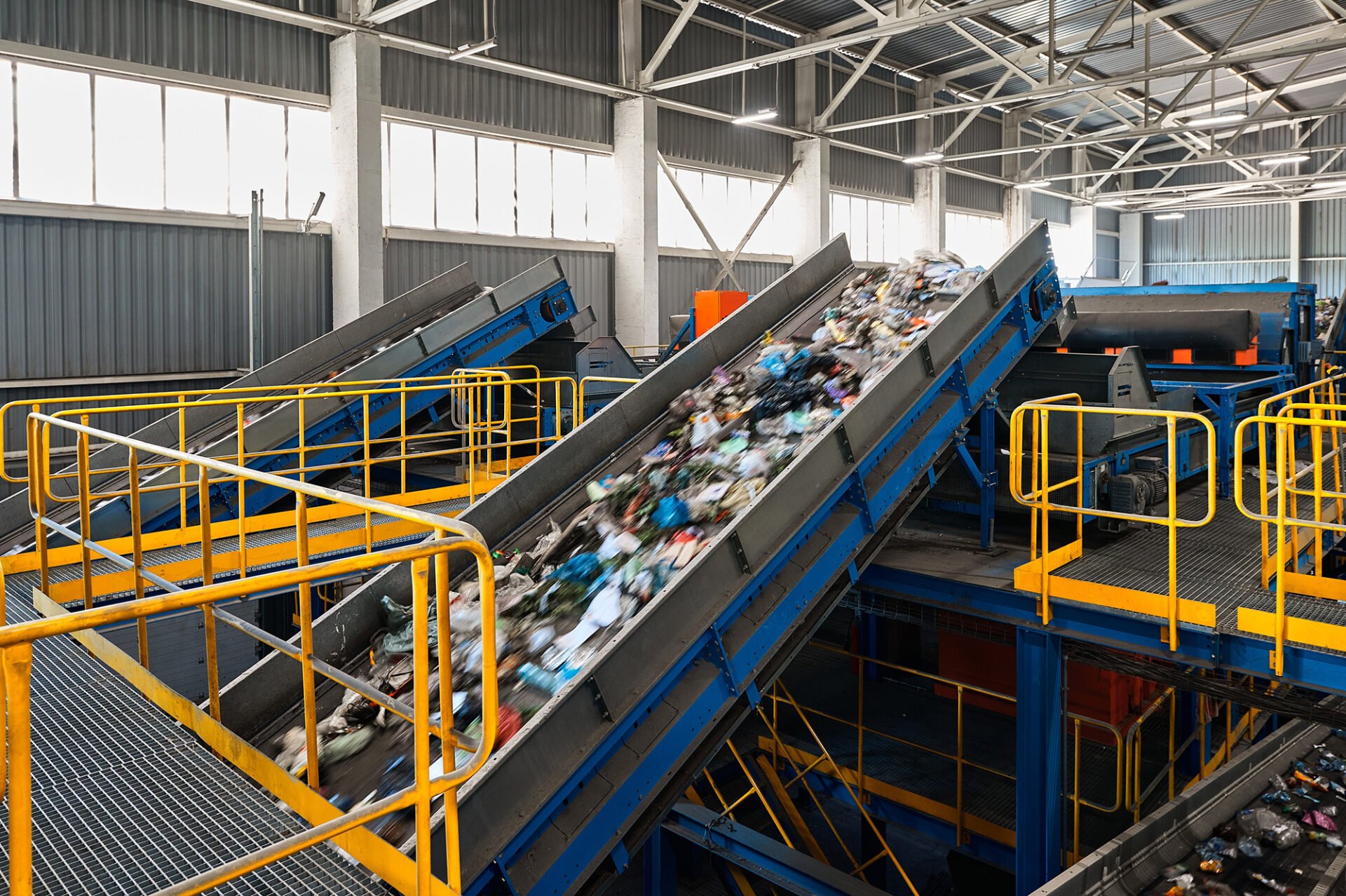 A recycling facility with a conveyor belt sorting trash