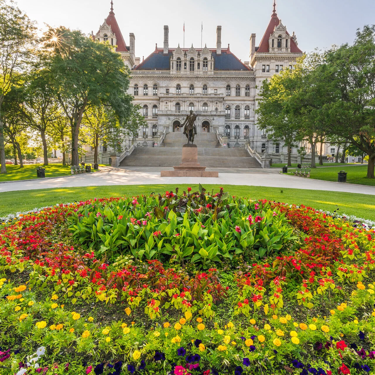 The Vermont State House with a flower garden
