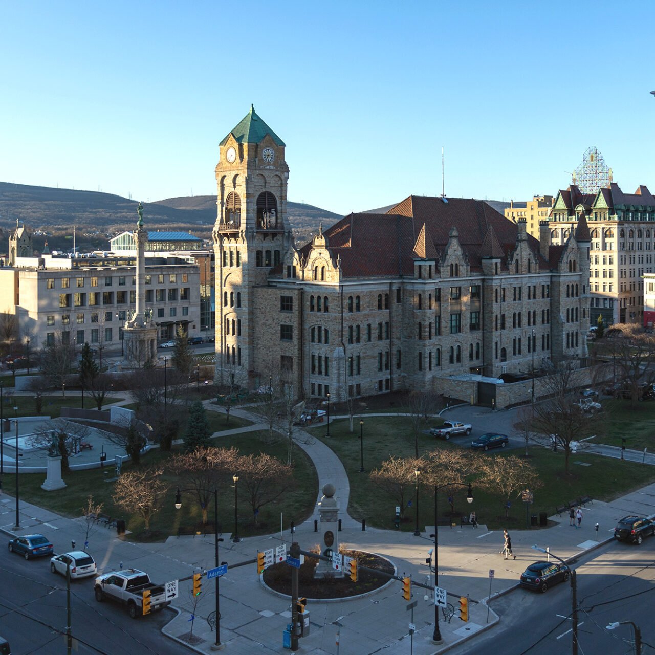 Cityscape with historic buildings and park A city street with historic buildings and a park